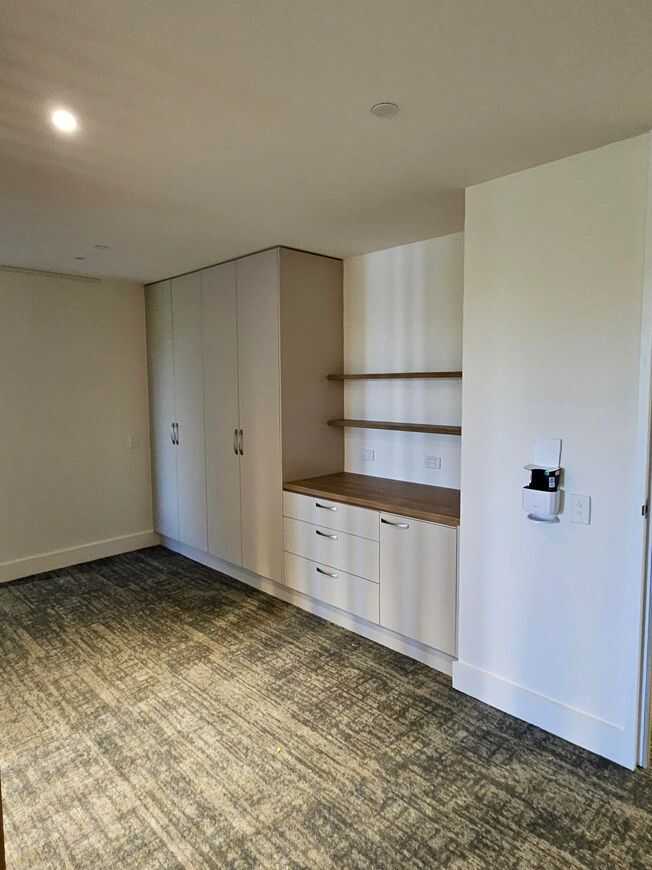 Image shows a VTF Constructions room cabinetry, The cabinet in the picture is a custom room cabinet in Melbourne, designed and crafted by VTF. Experts in Custom Cabinetry in Melbourne. Also, Specialising in Kitchen cabinetry, bathroom cabinetry, office cabinetry in Melbourne.
