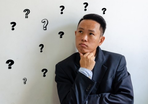 Homeowner asking questions to cabinet makers Melbourne before hiring for custom cabinets and kitchen cabinetry project