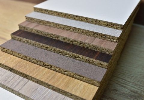 Kitchen cabinet materials comparison showing MDF, plywood, and solid timber durability differences